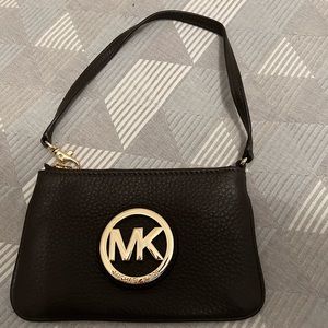 MK wristlet, brand new, rich brown leather. Mint condition!
